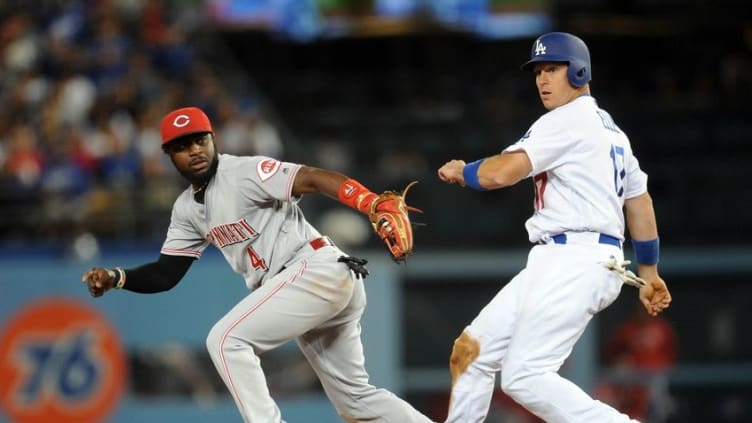 May 23, 2016; Los Angeles, CA, USA; Los Angeles Dodgers catcher A.J. Ellis (17) is out at second in the fifth inning against Cincinnati Reds second baseman Brandon Phillips (4) at Dodger Stadium. Mandatory Credit: Gary A. Vasquez-USA TODAY Sports