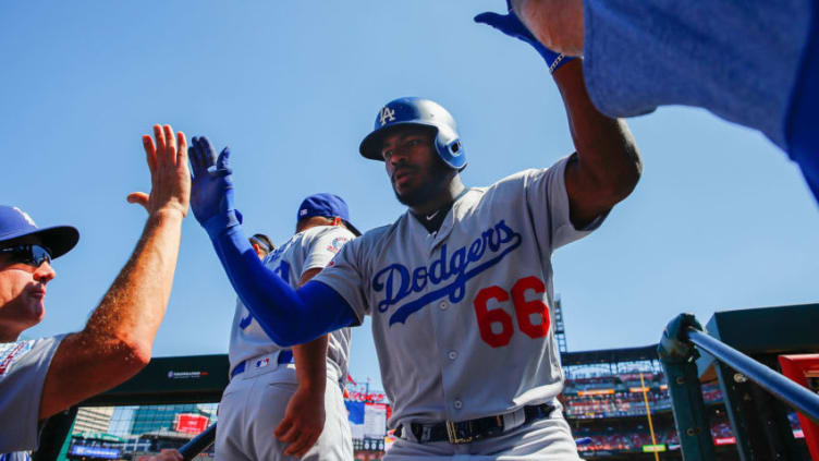 ST. LOUIS, MO - SEPTEMBER 15: Yasiel Puig #66 of the Los Angeles Dodgers is congratulated by teammates after hitting a home run against the St. Louis Cardinals in the fourth inning at Busch Stadium on September 15, 2018 in St. Louis, Missouri. (Photo by Dilip Vishwanat/Getty Images)