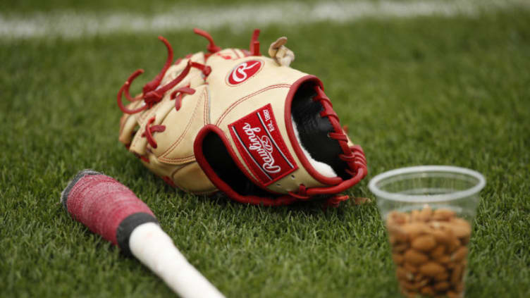 GOODYEAR, FL - MARCH 11: A Cincinnati Reds Rawlings glove on the field during the Spring Training game against the Cleveland Indians. (Photo by Mike McGinnis/Getty Images)