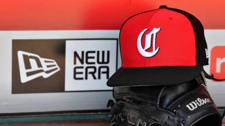 CINCINNATI, OH - MAY 14: A close up view of a hat and baseball glove in the dugout with the New Era logo before a game between the Cincinnati Reds and the Chicago Cubs. (Photo by Jamie Sabau/Getty Images) *** Local Caption ***