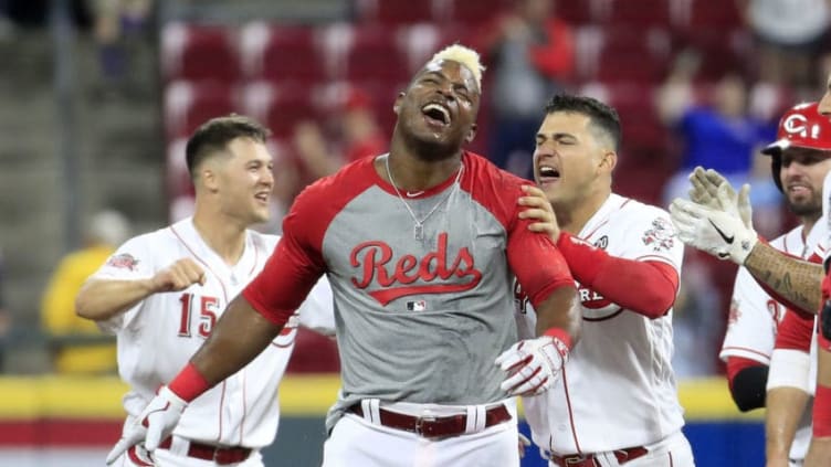 CINCINNATI, OHIO - MAY 15: Yasiel Puig #66 of the Cincinnati Reds celebrates with teammates after hitting a game winning single in the 10th inning against the Chicago Cubs at Great American Ball Park on May 15, 2019 in Cincinnati, Ohio. (Photo by Andy Lyons/Getty Images)