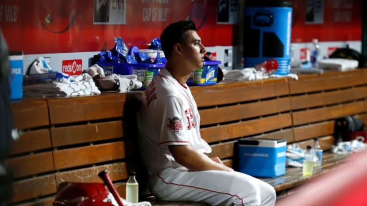CINCINNATI, OH - JULY 18: Robert Stephenson #55 of the Cincinnati Reds sits in the dugout after giving up a grand slam. (Photo by Kirk Irwin/Getty Images)