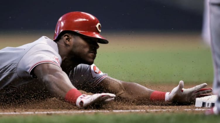 MILWAUKEE, WISCONSIN - JUNE 20: Yasiel Puig #66 of the Cincinnati Reds slides into third base for a triple in the fifth inning against the Milwaukee Brewers at Miller Park on June 20, 2019 in Milwaukee, Wisconsin. (Photo by Dylan Buell/Getty Images)