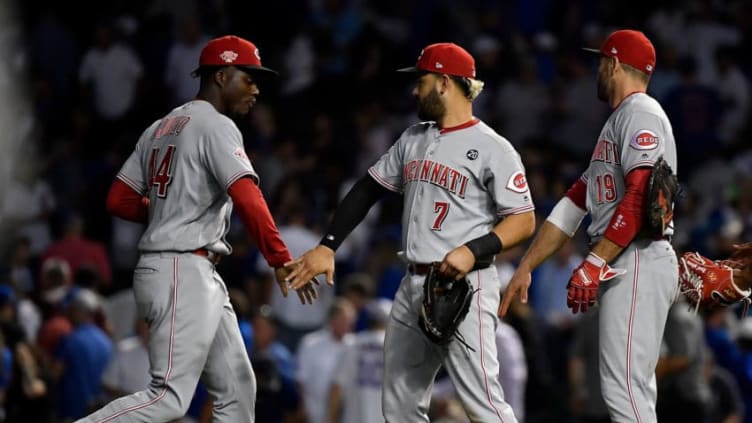 CHICAGO, ILLINOIS - SEPTEMBER 18: Aristides Aquino #44, Eugenio Suarez #7 and Joey Votto #19 of the Cincinnati Reds (Photo by Quinn Harris/Getty Images)