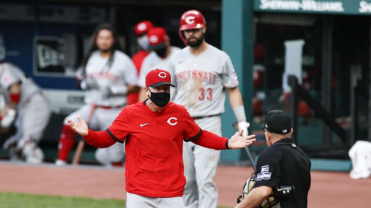 CLEVELAND, OH - AUGUST 06: Manager David Bell #25 of the Cincinnati Reds argues with umpire. (Photo by Ron Schwane/Getty Images)