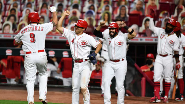 CINCINNATI, OH - SEPTEMBER 14: Mike Moustakas #9 of the Cincinnati Reds celebrates with Shogo Akiyama #4 of the Cincinnati Reds. (Photo by Jamie Sabau/Getty Images)