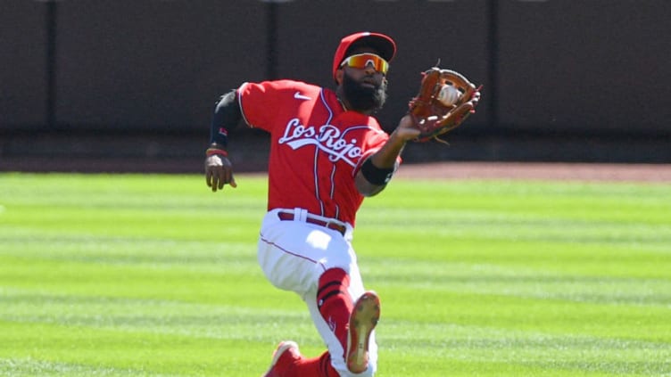 CINCINNATI, OH - SEPTEMBER 20: Brian Goodwin #17 of the Cincinnati Reds makes a sliding catch. (Photo by Jamie Sabau/Getty Images)