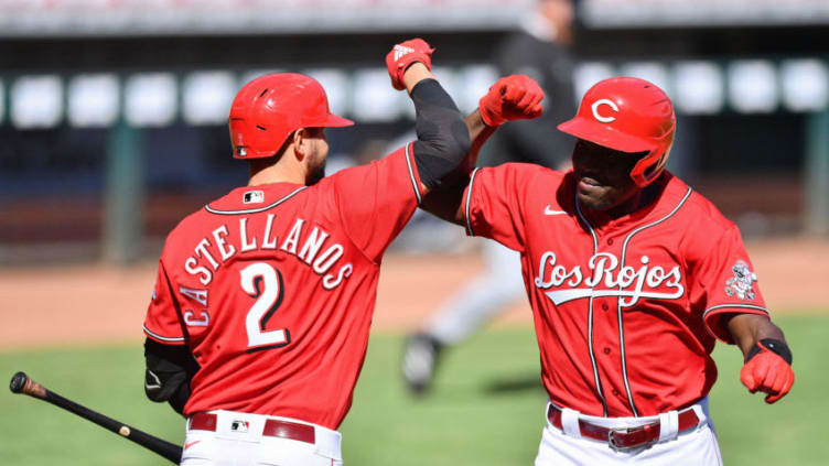 CINCINNATI, OH - SEPTEMBER 20: Aristides Aquino #44 of the Cincinnati Reds (R) celebrates with next batter Nick Castellanos #2 of the Cincinnati Reds after hitting a two-run home run. (Photo by Jamie Sabau/Getty Images)