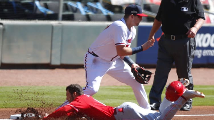 ATLANTA, GA - SEPTEMBER 30: Nick Senzel #15 of the Cincinnati Reds slides into third safe beating the tag . (Photo by Todd Kirkland/Getty Images)