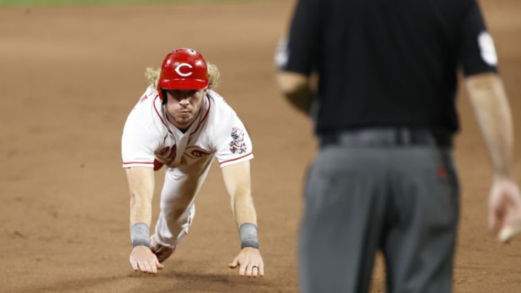 CINCINNATI, OH - AUGUST 12: Travis Jankowski #31 of the Cincinnati Reds slides headfirst into third base. (Photo by Joe Robbins/Getty Images)