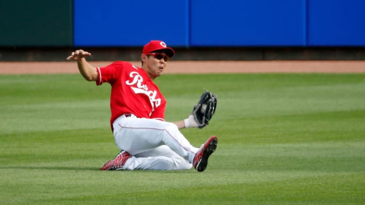 CINCINNATI, OH - AUGUST 29: Shogo Akiyama #4 of the Cincinnati Reds makes a sliding catch. (Photo by Kirk Irwin/Getty Images)