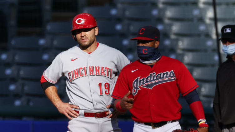 CLEVELAND, OH - AUGUST 06: Joey Votto #19 of the Cincinnati Reds stands with Carlos Santana #41 of the Cleveland Indians during the first inning. (Photo by Ron Schwane/Getty Images)