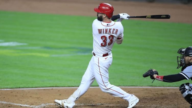 CINCINNATI, OHIO - SEPTEMBER 18: Jesse Winker #33 of the Cincinnati Reds hits a three run home run. (Photo by Andy Lyons/Getty Images)