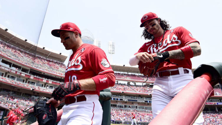 CINCINNATI, OHIO - JULY 04: Joey Votto #19 and Jonathan India #6 of the Cincinnati Reds walk off the field. (Photo by Emilee Chinn/Getty Images)