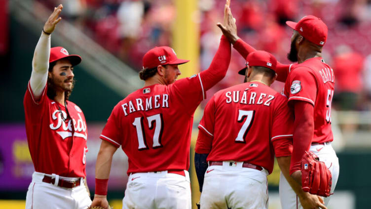 CINCINNATI, OHIO - JULY 04: Jonathan India #6, Kyle Farmer #17, Eugenio Suarez #7 and Amir Garrett #50 of the Cincinnati Reds celebrate a win. (Photo by Emilee Chinn/Getty Images)