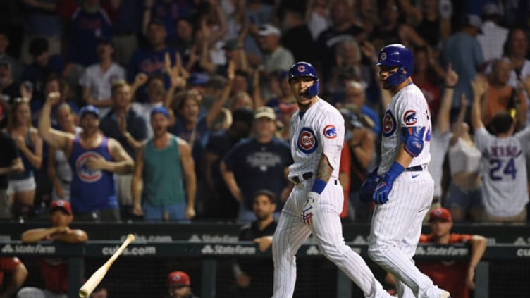 CHICAGO, ILLINOIS - JULY 26: Javier Baez #9 of the Chicago Cubs reacts after his walk off single in the ninth inning against the Cincinnati Reds. (Photo by Quinn Harris/Getty Images)