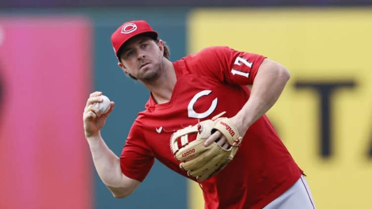 CLEVELAND, OHIO - AUGUST 09: Kyle Farmer #17 of the Cincinnati Reds warms up before a game . (Photo by Ron Schwane/Getty Images)