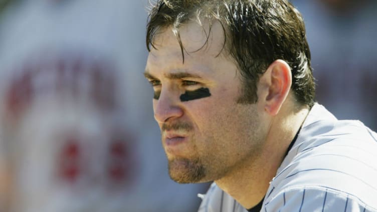 OAKLAND, CA - OCTOBER 6: Doug Mientkiewicz #16 of the Minnesota Twins looks out from the dugout during game five of the American League Western Division Series against the Oakland Athletics at Network Associates Coliseum on October 6, 2002 in Oakland, California. The Twins defeated the A's 5-4. (Photo by Jed Jacobsohn/Getty Images)