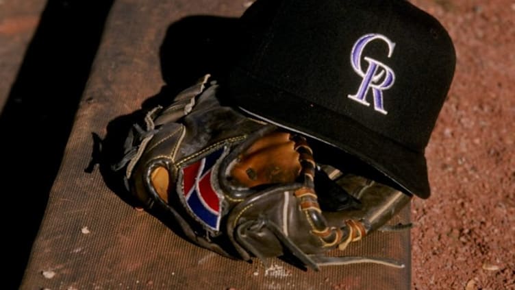 27 Feb 1998: A general view of a glove and a Colorado Rockies cap. Mandatory Credit: Brian Bahr /Allsport