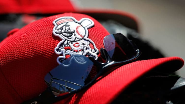 GOODYEAR, AZ - MARCH 24: A Cincinnati Reds hat is seen in the dugout during a game. (Photo by Sarah Glenn/Getty Images)