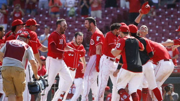 CINCINNATI, OH - JUNE 07: Jesse Winker #33 of the Cincinnati Reds celebrates with teammates after hitting a two-run home run to win the game in the 13th inning against the Colorado Rockies at Great American Ball Park on June 7, 2018 in Cincinnati, Ohio. The Reds won 7-5. (Photo by Joe Robbins/Getty Images)