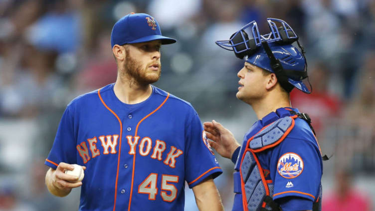 ATLANTA, GA - JUNE 12: Pitcher Zack Wheeler #45 of the New York Mets talks with catcher Devin Mesoraco #29 in the third inning during the game against the Atlanta Braves at SunTrust Park on June 12, 2018 in Atlanta, Georgia. (Photo by Mike Zarrilli/Getty Images)