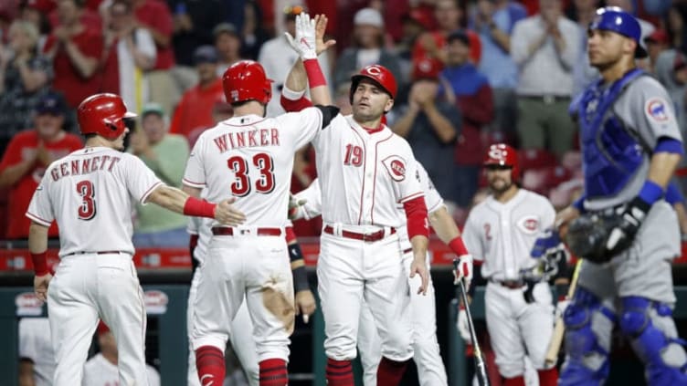 CINCINNATI, OH - JUNE 21: Jesse Winker #33 of the Cincinnati Reds celebrates with Joey Votto #19 and Scooter Gennett #3 after hitting a grand slam home run in the sixth inning to give his team the lead against the Chicago Cubs at Great American Ball Park on June 21, 2018 in Cincinnati, Ohio. (Photo by Joe Robbins/Getty Images)