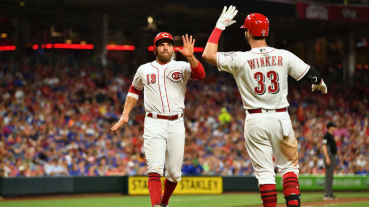 CINCINNATI, OH - JUNE 22: Joey Votto #19 of the Cincinnati Reds celebrates with Jesse Winker #33 of the Cincinnati Reds after scoring a run. (Photo by Jamie Sabau/Getty Images)