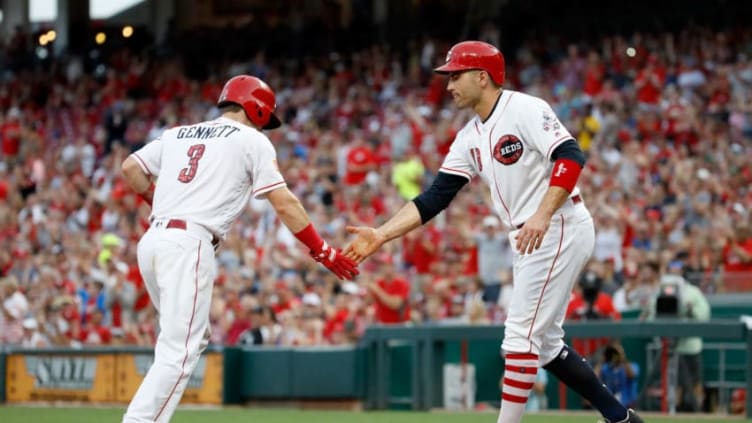 CINCINNATI, OH - JULY 04: Scooter Gennett #3 and Joey Votto #19 of the Cincinnati Reds congratulate each other after scoring in the 4th inning against the Chicago White Sox at Great American Ball Park on July 4, 2018 in Cincinnati, Ohio. (Photo by Andy Lyons/Getty Images)