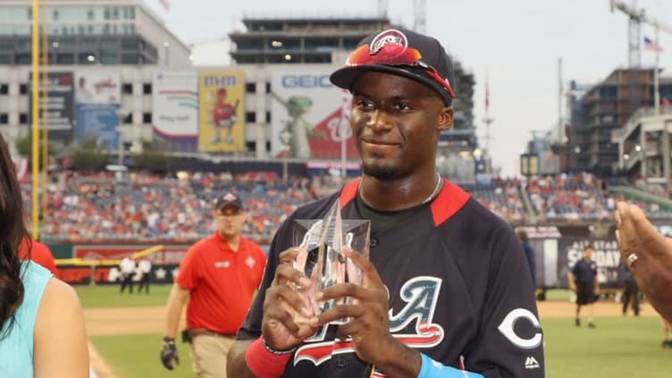 WASHINGTON, DC - JULY 15: Taylor Trammell #5 of the Cincinnati Reds and the U.S. Team poses with the Larry Doby Award after defeating the World Team in the SiriusXM All-Star Futures Game at Nationals Park on July 15, 2018 in Washington, DC. (Photo by Rob Carr/Getty Images)