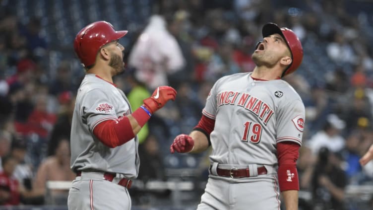 SAN DIEGO, CA - APRIL 18: Joey Votto #19 of the Cincinnati Reds celebrates with Eugenio Suarez #7 after hitting a solo home run. (Photo by Denis Poroy/Getty Images)