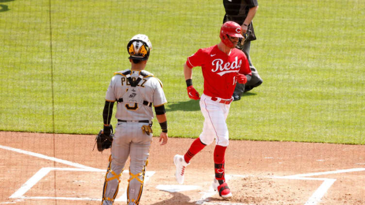 CINCINNATI, OH - APRIL 07: Tyler Naquin #12 of the Cincinnati Reds crosses home plate. (Photo by Kirk Irwin/Getty Images)