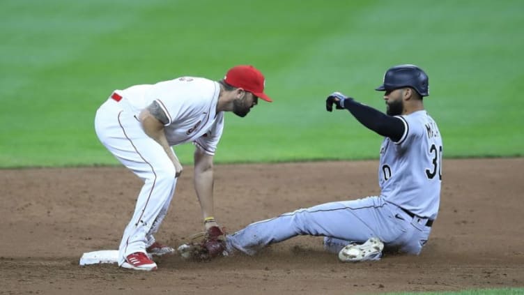 CINCINNATI, OHIO - SEPTEMBER 18: Mike Moustakas #9 of the Cincinnati Reds tags out Nomar Mazara #30 of the Chicago White Sox. (Photo by Andy Lyons/Getty Images)