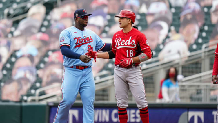 MINNEAPOLIS, MN - SEPTEMBER 27: Miguel Sano #22 of the Minnesota Twins talks with Joey Votto #19 of the Cincinnati Reds. (Photo by Brace Hemmelgarn/Minnesota Twins/Getty Images)