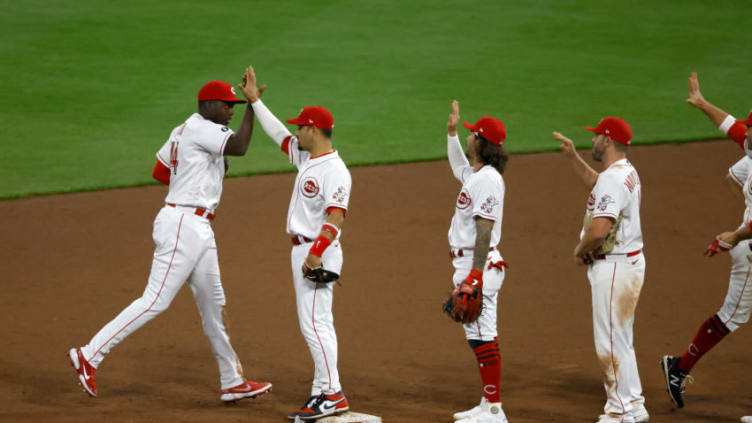 CINCINNATI, OHIO - APRIL 05: Aristides Aquino #44 of the Cincinnati Reds is congratulated by Eugenio Suarez. (Photo by Kirk Irwin/Getty Images)