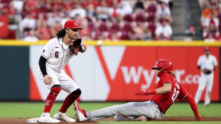 CINCINNATI, OHIO - JUNE 28: Alec Bohm #28 of the Philadelphia Phillies steals second base past Jonathan India #6 of the Cincinnati Reds. (Photo by Dylan Buell/Getty Images)