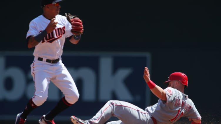 MINNEAPOLIS, MN - APRIL 29: Tucker Barnhart #16 of the Cincinnati Reds slides into second unsuccessfully while Ehire Adrianza #16 of the Minnesota Twins trans the double play in the first inning at Target Field on April 29, 2018 in Minneapolis, Minnesota. (Photo by Adam Bettcher/Getty Images)