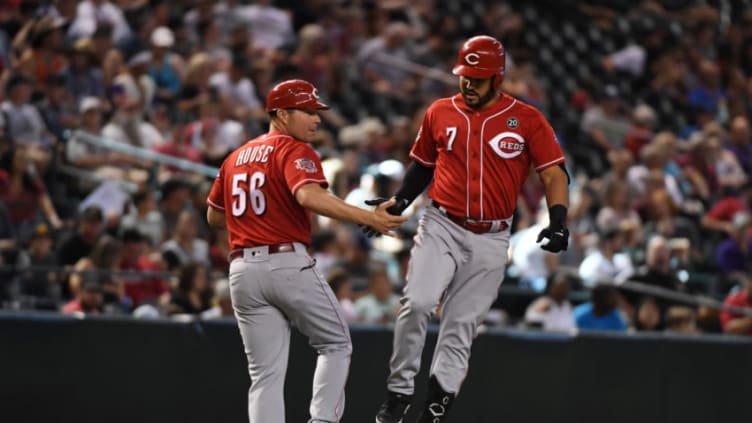 PHOENIX, ARIZONA - SEPTEMBER 15: Eugenio Suarez #7 of the Cincinnati Reds celebrates with third base coach JR House #56 after hitting a solo home run off of Zac Gallen #59 of the Arizona Diamondbacks during the sixth inning at Chase Field on September 15, 2019 in Phoenix, Arizona. It was the second home run of the game for Suarez. (Photo by Norm Hall/Getty Images)