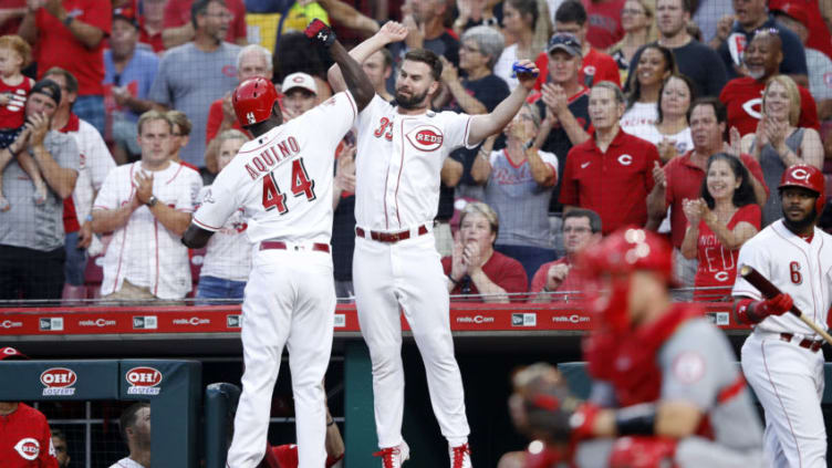 CINCINNATI, OH - AUGUST 06: Aristides Aquino #44 of the Cincinnati Reds celebrates with Jesse Winker #33 ](Photo by Joe Robbins/Getty Images)