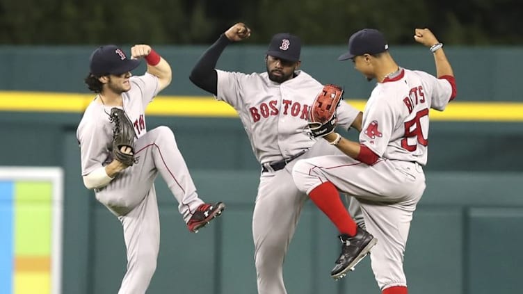 Aug 20, 2016; Detroit, MI, USA; Boston Red Sox left fielder Andrew Benintendi (left) center fielder Jackie Bradley Jr. (center) and right fielder Mookie Betts (right) celebrate after the game against the Detroit Tigers at Comerica Park. Red Sox win 3-2. Mandatory Credit: Raj Mehta-USA TODAY Sports