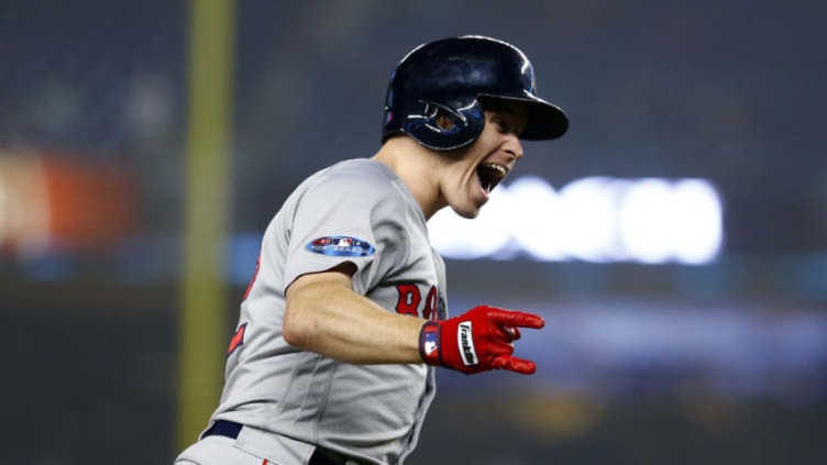 NEW YORK, NEW YORK - OCTOBER 08: Brock Holt #12 of the Boston Red Sox celebrates after hitting a two run home run against Austin Romine #28 of the New York Yankees during the ninth inning in Game Three of the American League Division Series at Yankee Stadium on October 08, 2018 in the Bronx borough of New York City. (Photo by Mike Stobe/Getty Images)