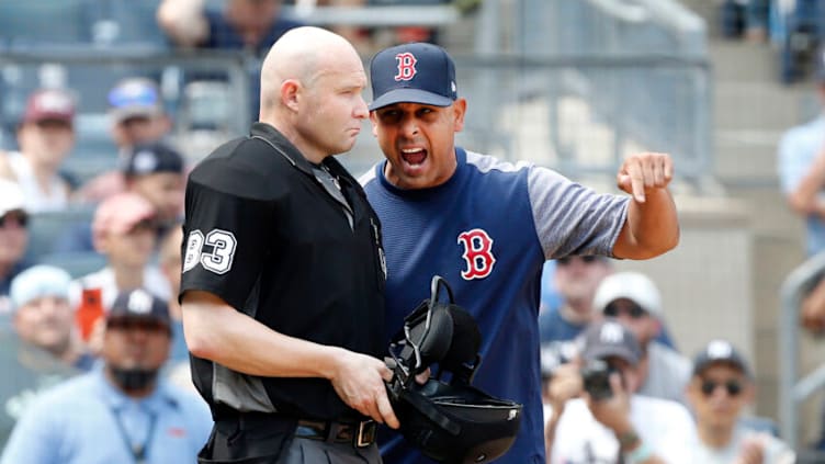 NEW YORK, NEW YORK - AUGUST 03: (NEW YORK DAILIES OUT) Manager Alex Cora #20 of the Boston Red Sox argues with umpire Mike Estabrook during a game against the New York Yankees at Yankee Stadium on August 03, 2019 in New York City. The Yankees defeated the Red Sox 9-2. (Photo by Jim McIsaac/Getty Images)