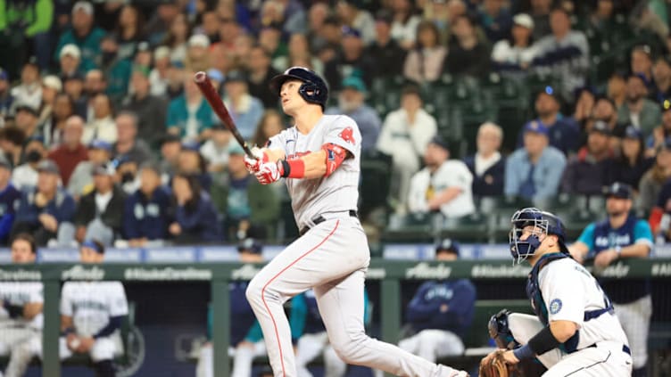 SEATTLE, WASHINGTON - JUNE 11: Bobby Dalbec #29 of the Boston Red Sox hits a solo home run against the Seattle Mariners to take a 6-5 lead during the ninth inning at T-Mobile Park on June 11, 2022 in Seattle, Washington. (Photo by Abbie Parr/Getty Images)