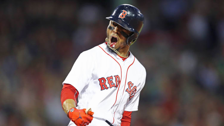 BOSTON, MA - JULY 12: Mookie Betts #50 of the Boston Red Sox celebrates after hitting a grand slam against the Toronto Blue Jays during the fourth inning at Fenway Park on July 12, 2018 in Boston, Massachusetts. (Photo by Maddie Meyer/Getty Images)