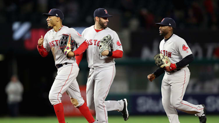 ANAHEIM, CA - APRIL 18: Mookie Betts #50, J.D. Martinez #28 and Jackie Bradley Jr. #19 of the Boston Red Sox celebrate as they run off the field after defeating the Los Angeles Angels of Anaheim 9-0 in a game at Angel Stadium on April 18, 2018 in Anaheim, California. (Photo by Sean M. Haffey/Getty Images)