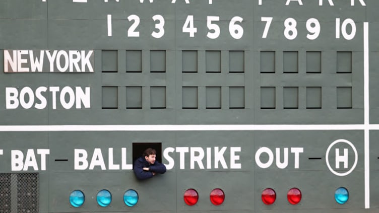 BOSTON, MA - APRIL 11: A scorekeeper looks on from inside the Green Monster before the game between the Boston Red Sox and the New York Yankees at Fenway Park on April 11, 2018 in Boston, Massachusetts. (Photo by Maddie Meyer/Getty Images)