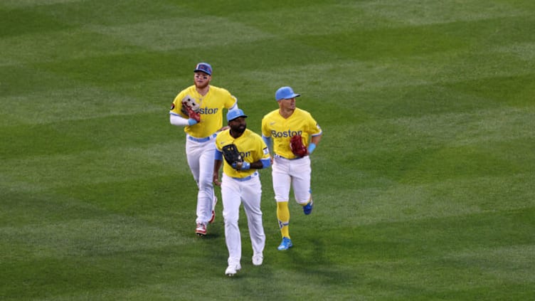 BOSTON, MASSACHUSETTS - APRIL 16: Jackie Bradley Jr. #19, Enrique Hernandez #5 and Alex Verdugo #99 of the Boston Red Sox run in from the outfield after their victory over The Minnesota Twins at Fenway Park on April 16, 2022 in Boston, Massachusetts. (Photo by Omar Rawlings/Getty Images)