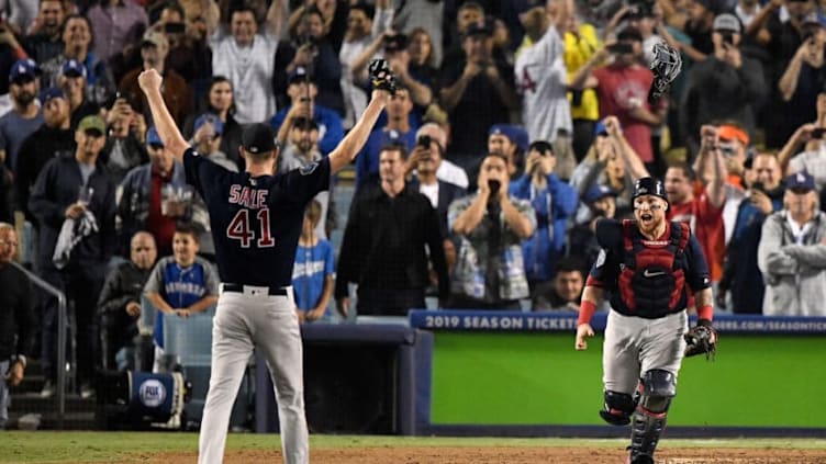 LOS ANGELES, CA - OCTOBER 28: Christian Vazquez #7 jumps into the arms of Chris Sale #41 of the Boston Red Sox to celebrate their 5-1 win over the Los Angeles Dodgers in Game Five to win the 2018 World Series at Dodger Stadium on October 28, 2018 in Los Angeles, California. (Photo by Kevork Djansezian/Getty Images)