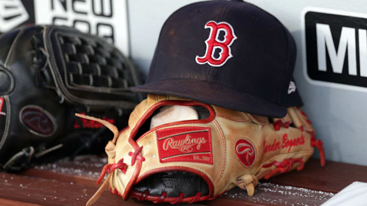 PHILADELPHIA, PA - AUGUST 14: A Rawlings leather baseball glove and a hat sit on the bench in the dugout before a game between the Boston Red Sox and the Philadelphia Phillies at Citizens Bank Park on August 14, 2018 in Philadelphia, Pennsylvania. The Red Sox won 2-1. (Photo by Hunter Martin/Getty Images)