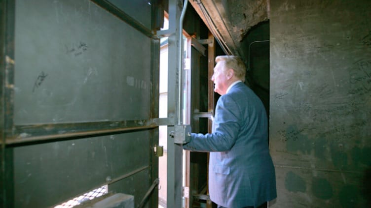 Los Angeles Dodgers Hall of Fame announcer Vin Scully stares out the door of the green monster at Fenway Park in Boston, Massachusetts (Photo by Jon Soohoo/WireImage)